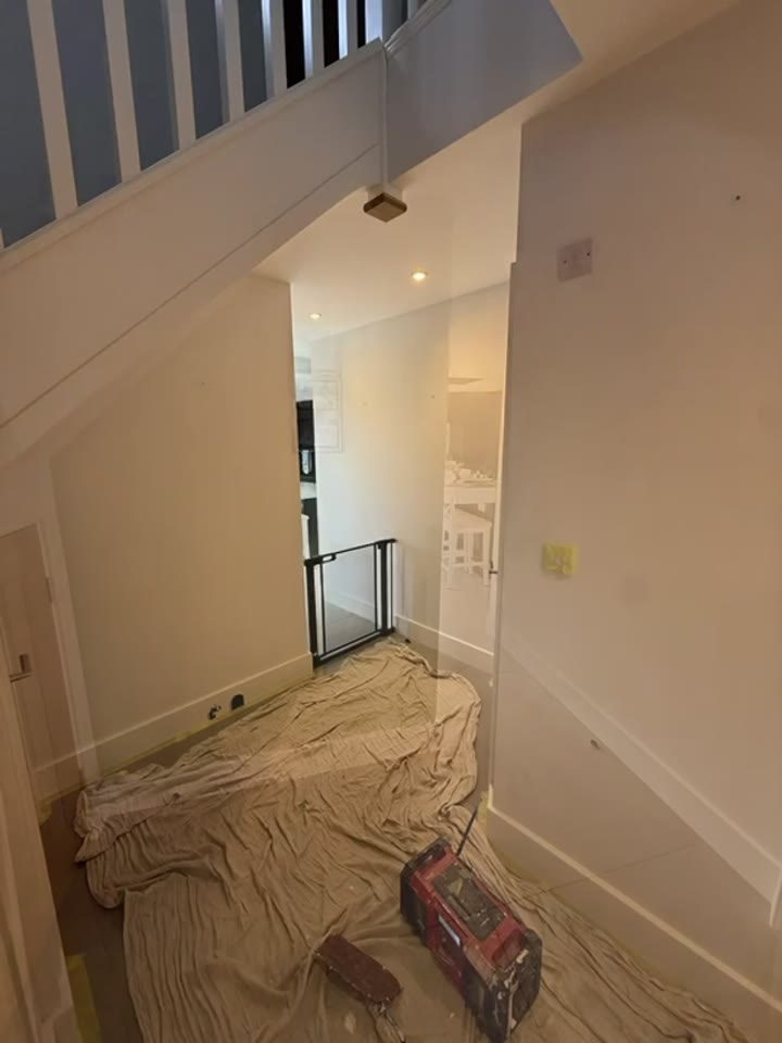 Before: Hallway entrance before and after painting