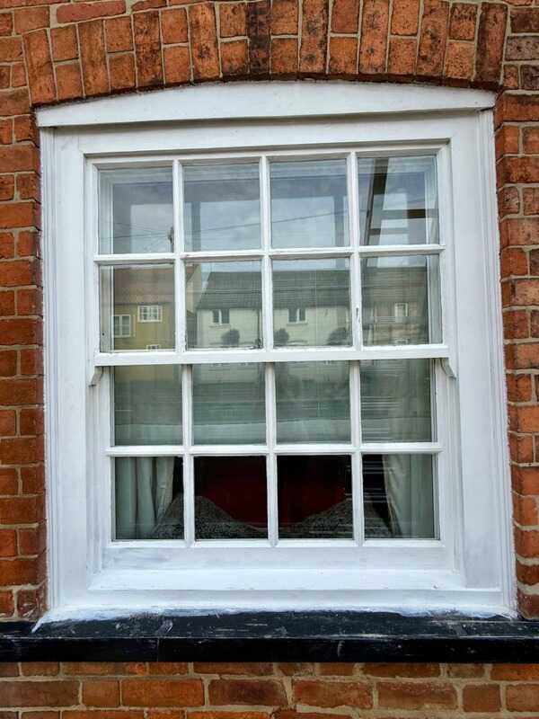 Before: Sash window before and after restoration